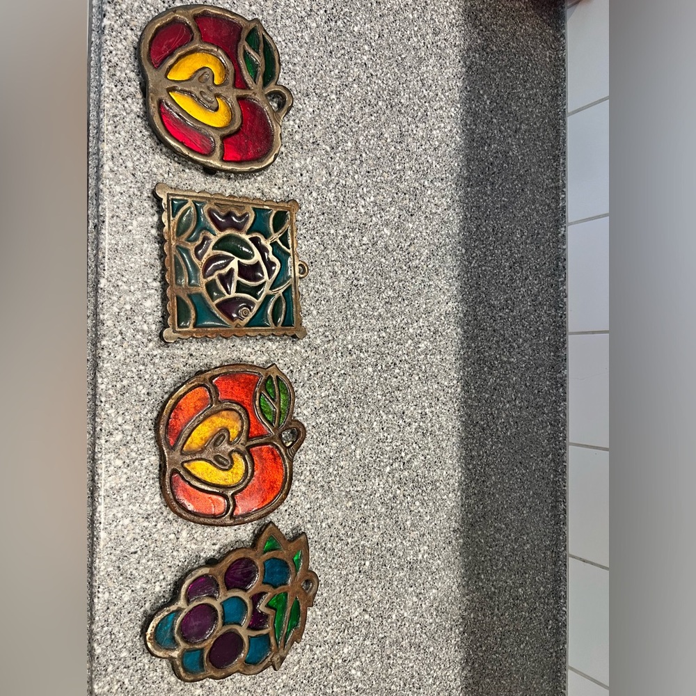 4 vintage trivets stained glass style.